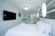 Main bedroom with 55 inch tv - Self Catering Apartment Accommodation in Umhlanga Rocks