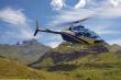 Helicopter flips over the majestic mountains - Hotel Accommodation in Cathedral Peak