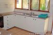 Kitchen fully equipped with microwave, fridge and freezer