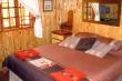 Main bedroom, queen size bed - Self Catering Cottage Accommodation in Little Switzerland