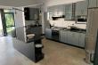 Modern kitchen with separate scullery and all the appliances