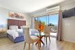 ocean view suite with open plan bathroom, spa bath and balcony