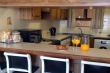 Fully equipped kitchen and breakfast bar