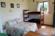 Interior open plan B villa with double bed + bunk, upper level