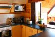 Kitchen with hatch open to the deck - Self Catering Accommodation in Palm Beach