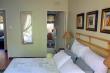 Lovely en suite main bedroom with sliding door that leads onto stoep. Secured with trellidor