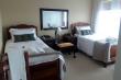 Twin room 4 with full bathroom and view of Mossel Bay.