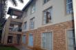 View from the outside of Ramsgate Palms Unit 15 (First floor unit with white patio furniture)