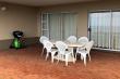Large patio with gas barbeque and full frontal seaview