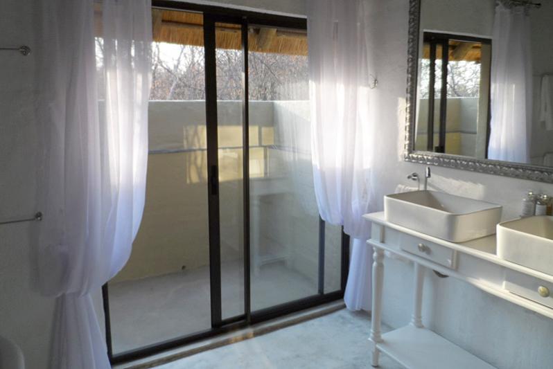 Shikwari Knobthorn Bathroom double vanity, outside shower