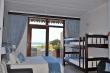 Bedroom leading onto balcony - Self Catering Apartment Accommodation in Winklespruit
