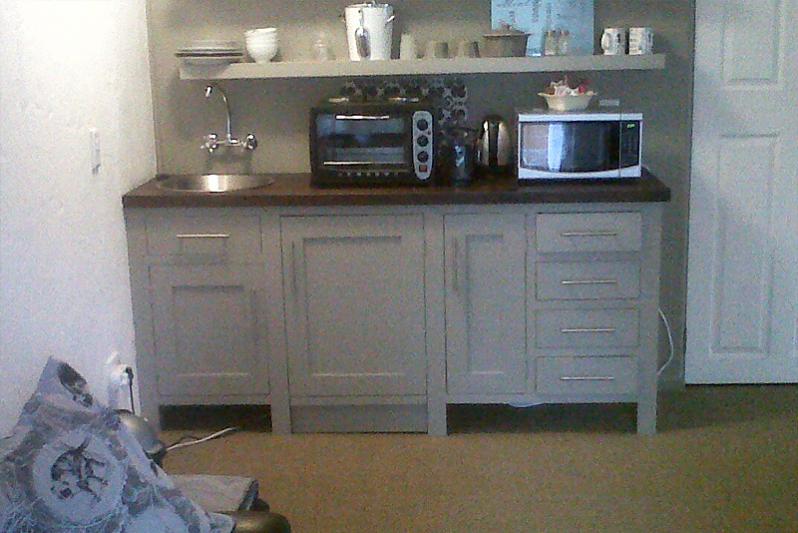 Kitchenette with fridge, microwave, toaster & kettle