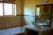 Fire Thorn Main bathroom with bath and shower. @nd bathroom only shower