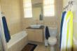 Full bathroom with bath and shower