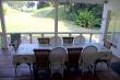 Covered veranda area with 10  seater table 