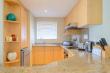 Fully equipped kitchen with dishwasher, washing machine and tumble dryer.