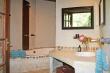 The en-suite bathroom with its relaxing and rustic interior.