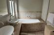 Main bedroom en-suite with bath and double shower 
