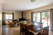 Open plan living / dining / kitchen area at Sunset Cottage with sliding doors on to private patio