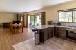 Open plan living / dining / kitchen area at Forest Cottage with sliding doors on to private patio