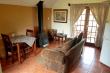 Poacher lounge with fireplace, dining & kitchen