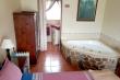 Poacher bedroom with spa bath, as well as en-suite bathroom with shower