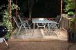 tables, chairs and lighting at night for braais